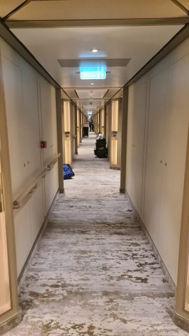 The long hallway of passenger cabins